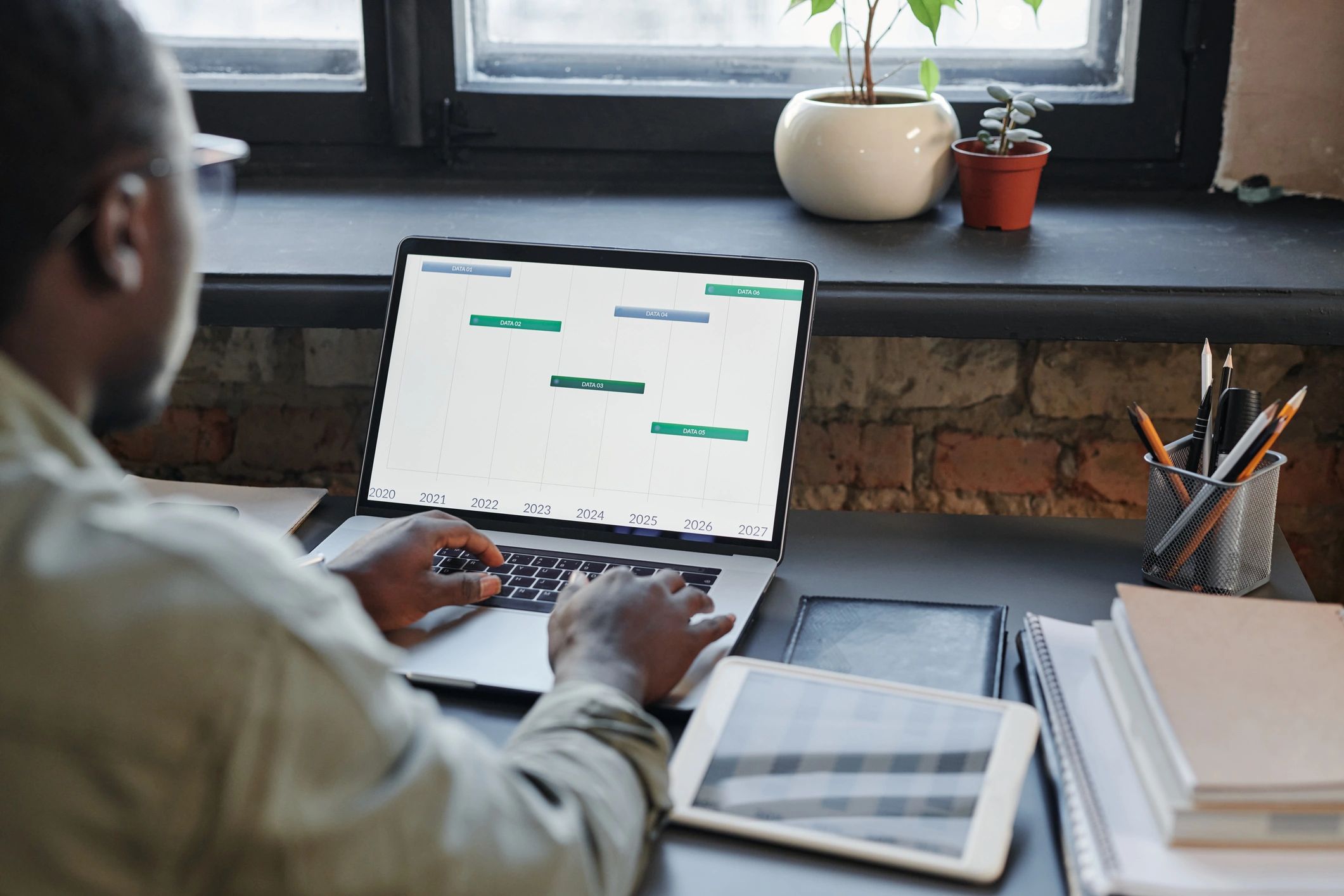 Financial analyst reviewing trading data at desk