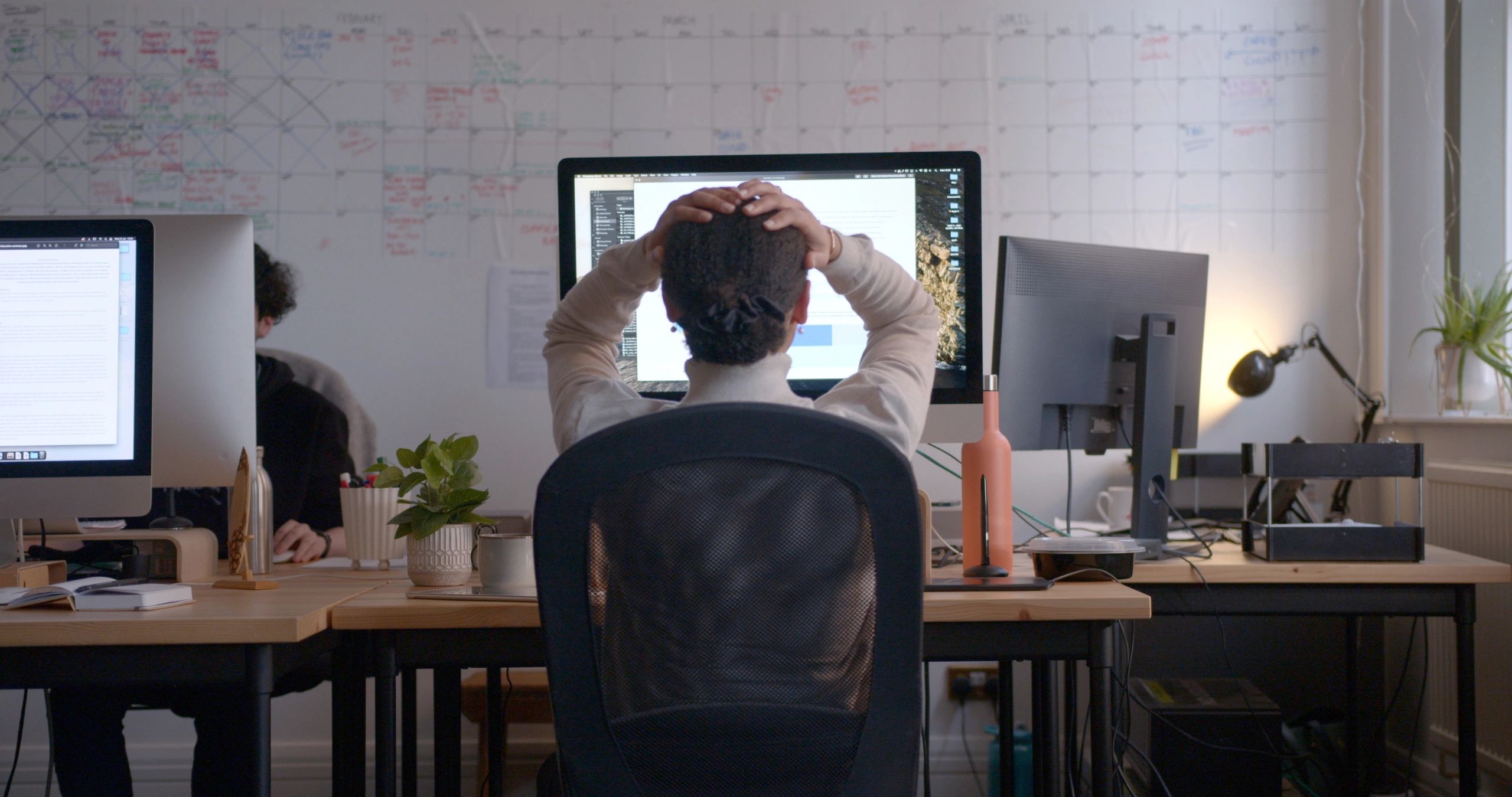 Analyst reviewing market data at workstation