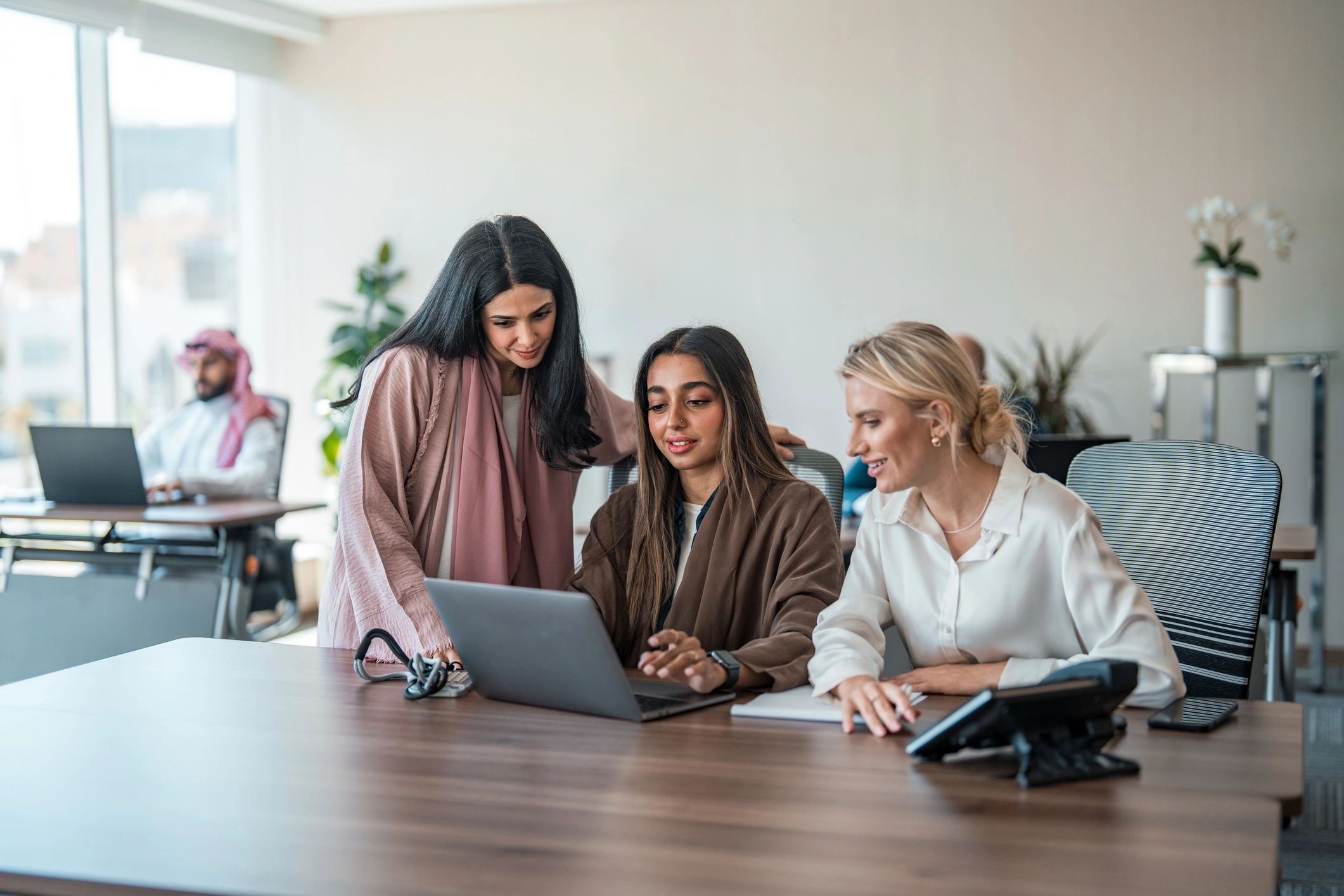 Financial professionals collaborating in a modern office